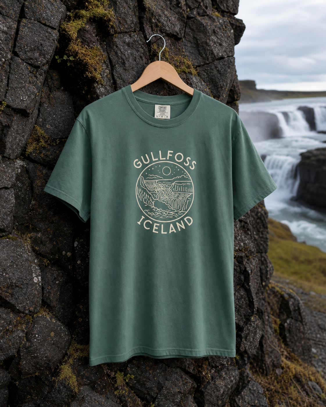 Blue Spruce Gullfoss Iceland T-Shirt with the front waterfall print against Icelandic basalt