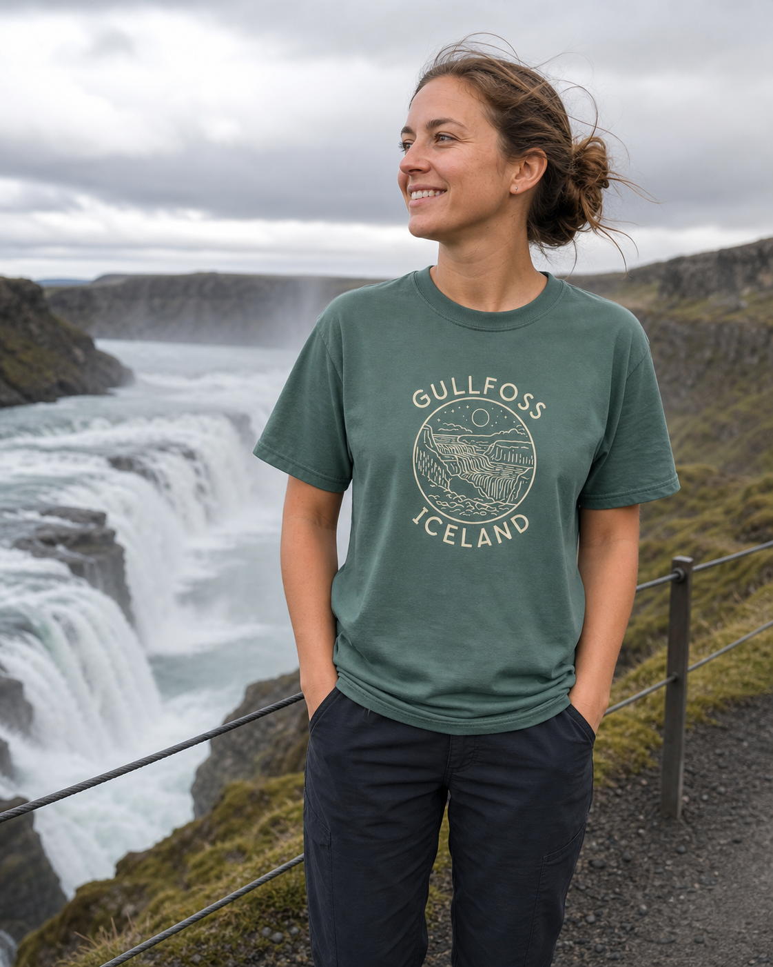 Person wearing the Blue Spruce Gullfoss Iceland T-Shirt at Gullfoss waterfall