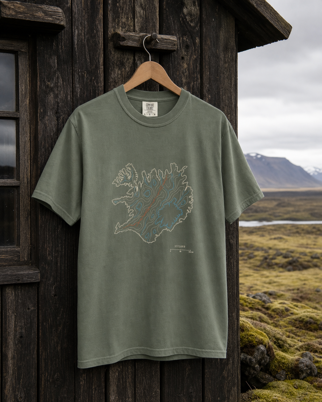 Moss Comfort Colors 1717 Iceland Rifted Relief T-Shirt hanging outside an Icelandic field cabin