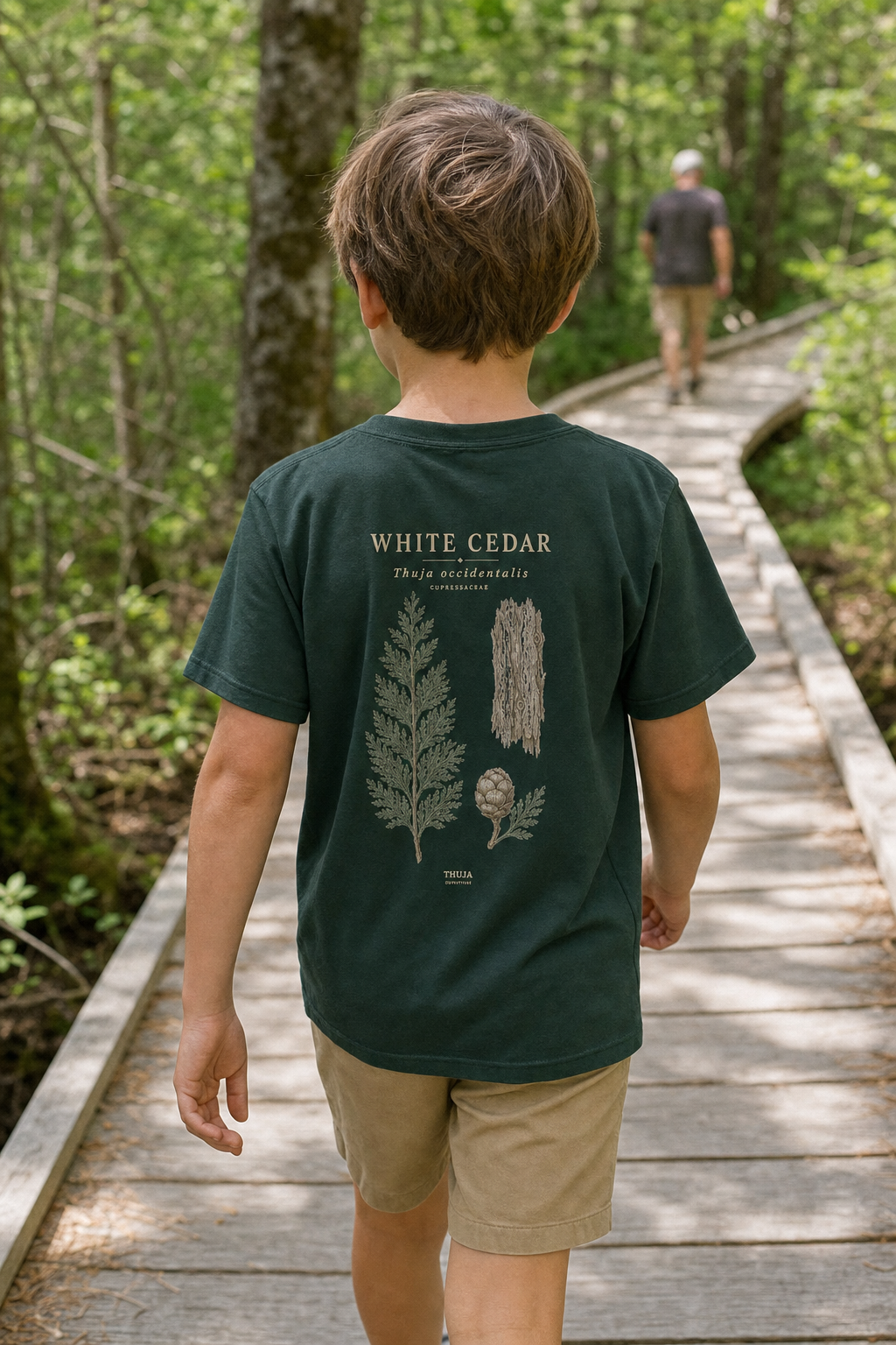 Child wearing the Forest Kids White Cedar Botanical T-Shirt on a Northwoods cedar trail