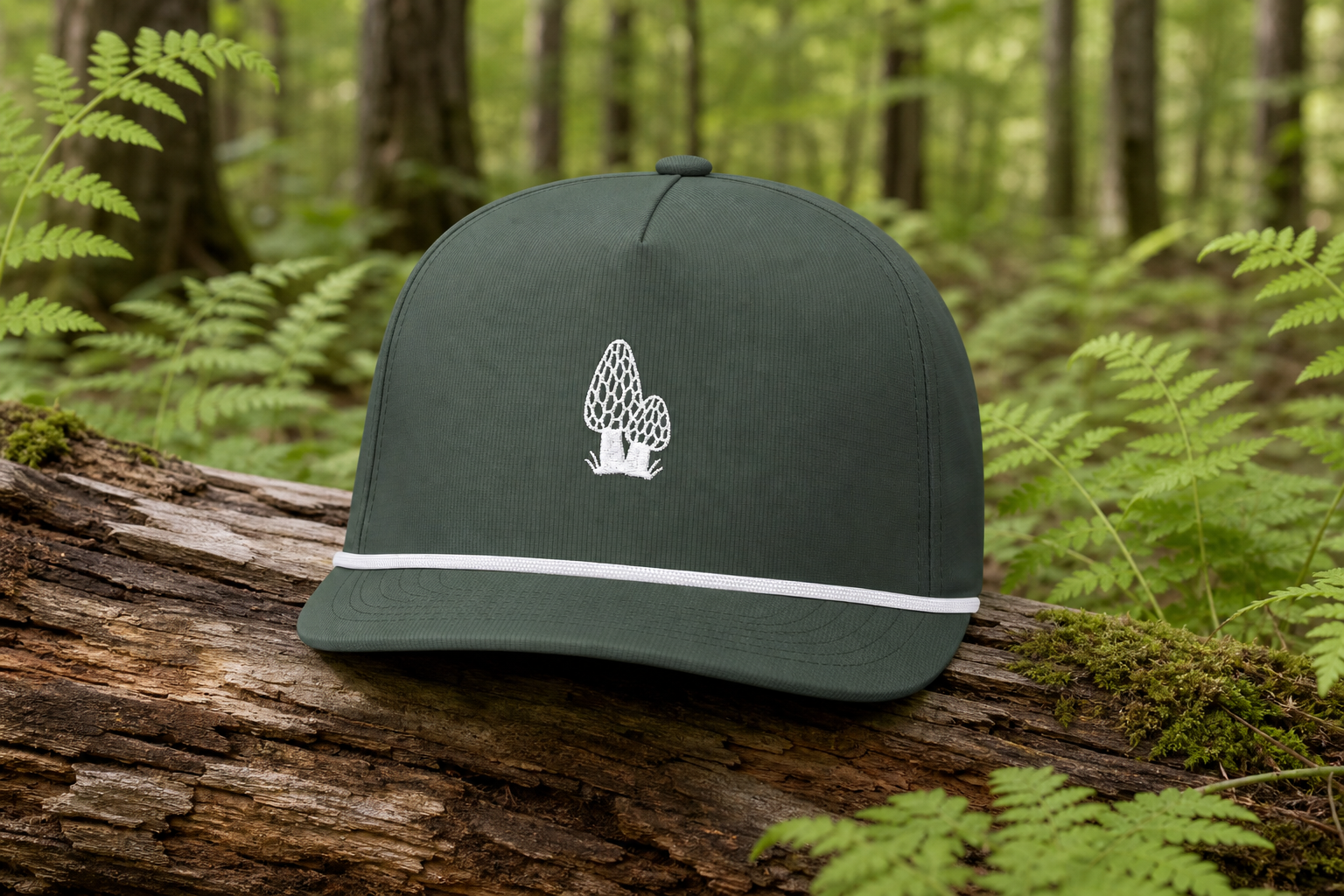 Moss Morel Forager Sunwashed Rope Cap with white morel embroidery and white rope on a northwoods cedar log